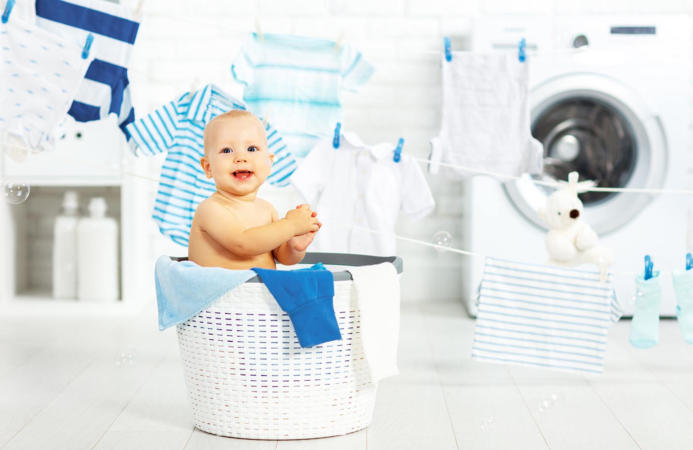 baby boy in a laundry basket