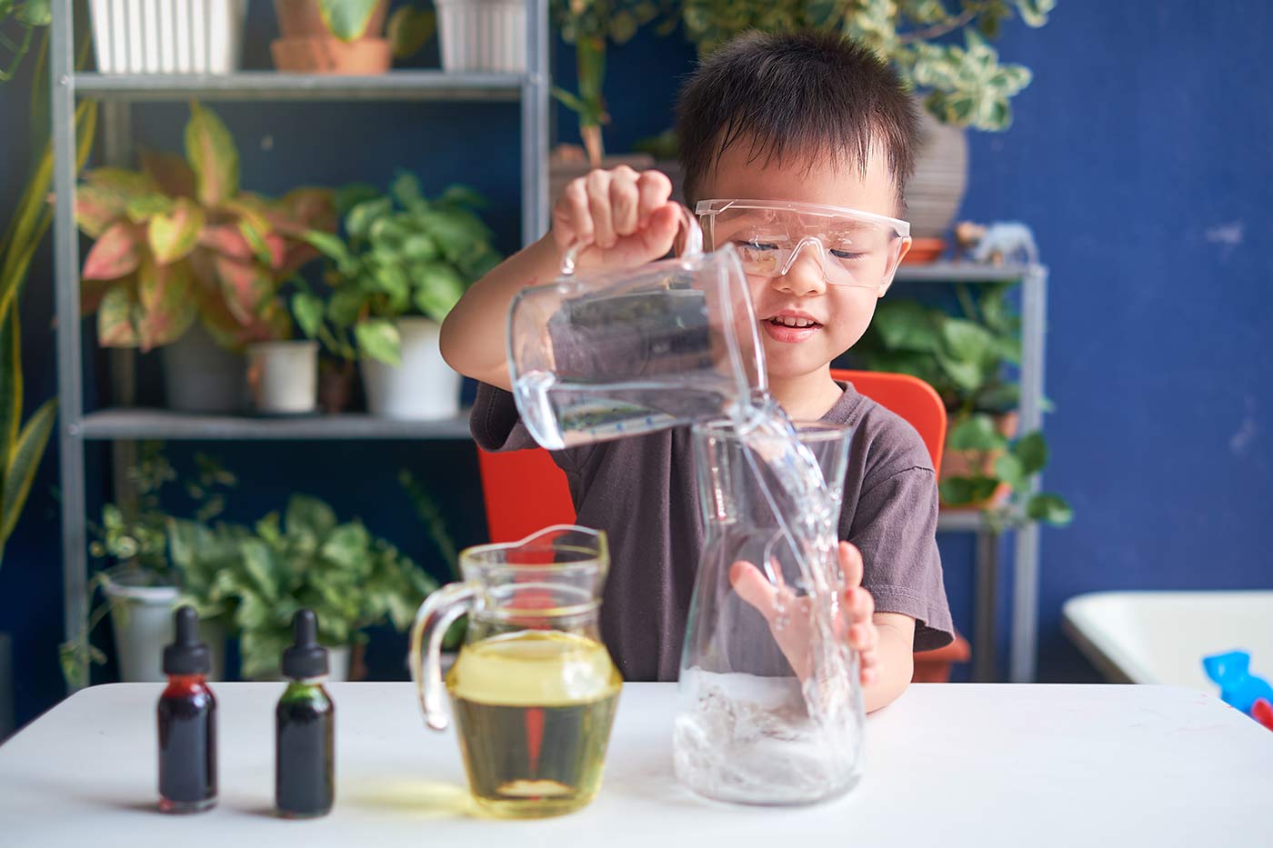 child doing science experiment